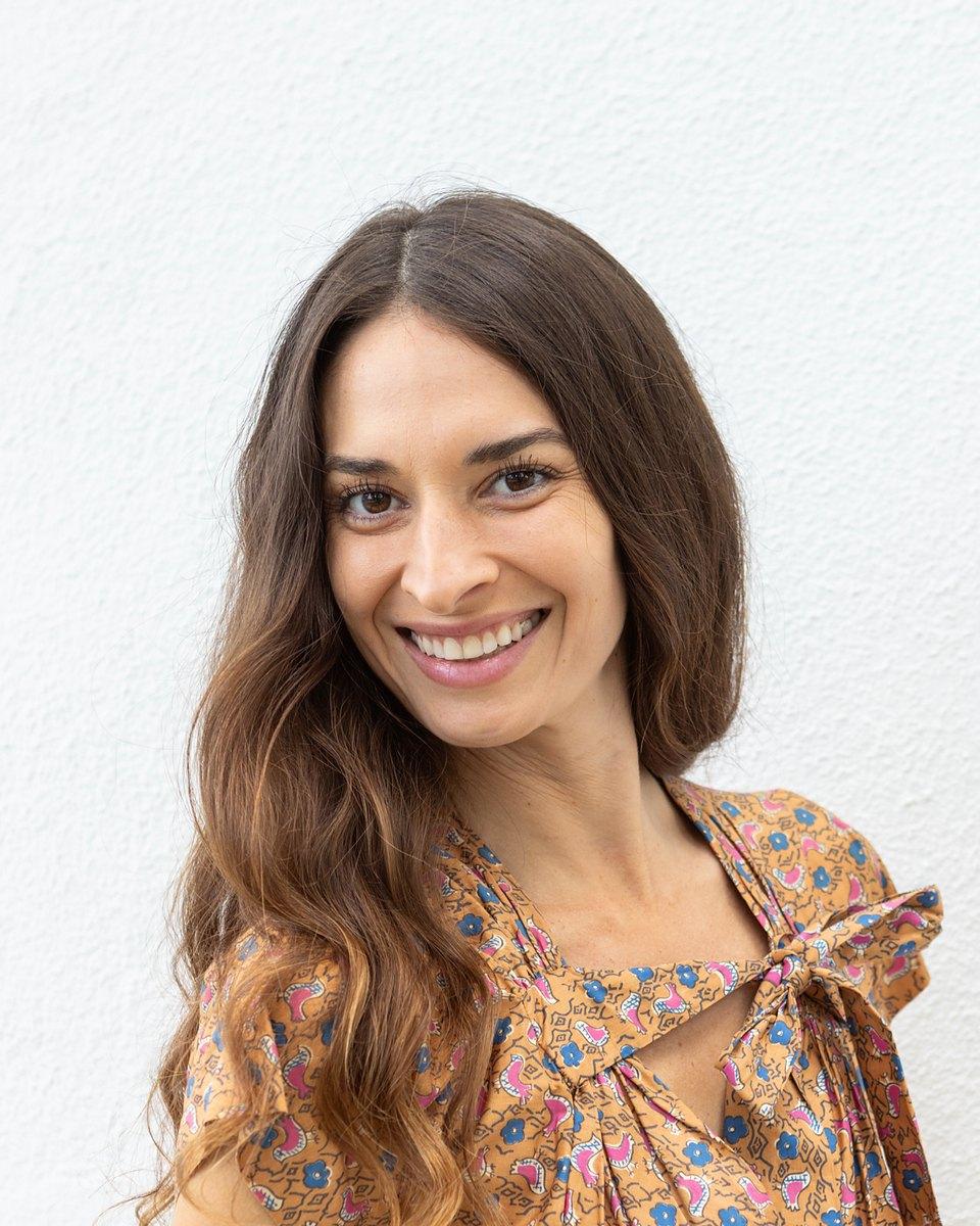 Portrait of Samantha Jimenez, founder of Volna Global, smiling.